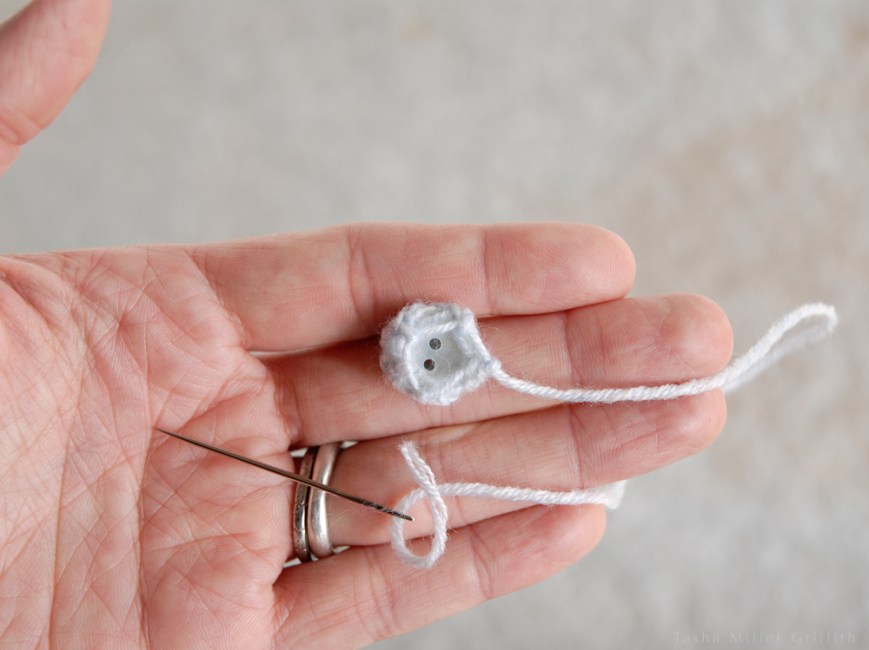 tiny knit covered buttons gathering back